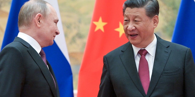 President Vladimir Putin and Chinese President Xi Jinping pose during a meeting at the Diaoyutai State Guesthouse on Feb. 4, 2022.