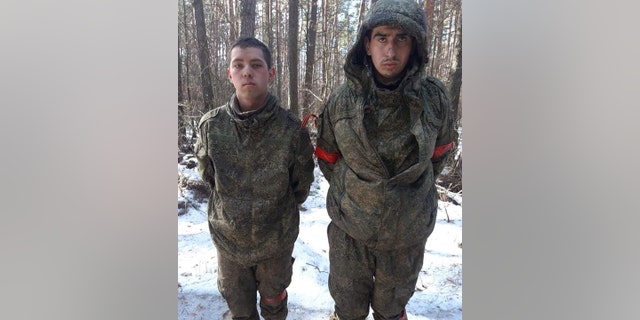 Two Russian soldiers taken prisoner near Kyiv, by Ukraine following Russia's military operation in Ukraine on Feb. 24, 2022.