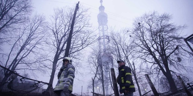 Emergency crews respond after a missile caused damage near Kyiv's TV Tower in Ukrainian capital, Kyiv on March 1, 2022. (Photo by State Emergency Service of Ukraine / Handout/Anadolu Agency via Getty Images)