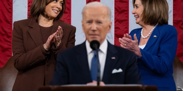 U.S. House Speaker Nancy Pelosi, a Democrat from California, right, and U.S. Vice President Kamala Harris talk as as U.S. President Joe Biden, center, speaks during a State of the Union address at the U.S. Capitol in Washington, D.C., U.S., on Tuesday, March 1, 2022.