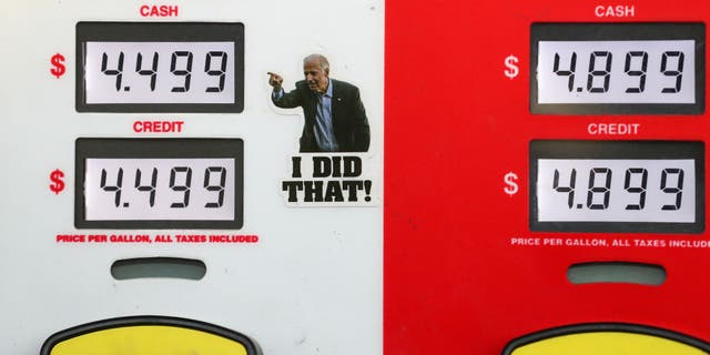 A satirical sticker of US President Joe Biden is placed on a gas pump at a Turkey Hill station. AAA reported the national average  price for a gallon of gas in the United States was a record high of $4.173.
