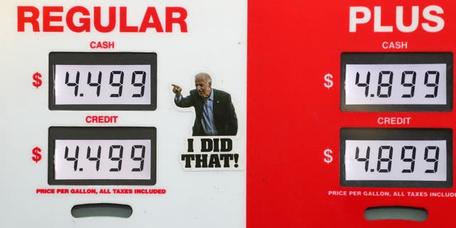 A satirical sticker of US President Joe Biden is placed on a gas pump at a Turkey Hill station. AAA reported the national average  price for a gallon of gas in the United States was a record high of $4.173.