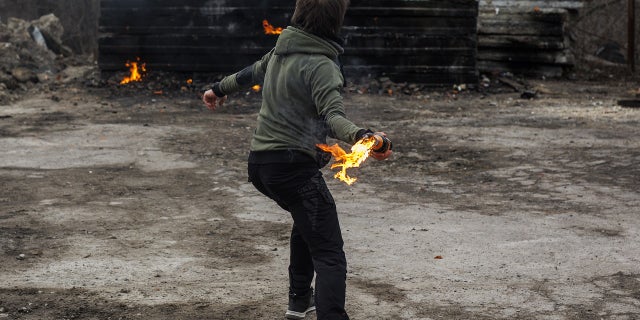 Civilians make Molotov cocktails and train amid Russian attacks in Lviv, Ukraine, March 8, 2022.