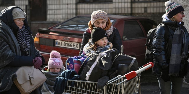Residents wait to be evacuated from the town of Irpin, north of kyiv, on March 10, 2022. 