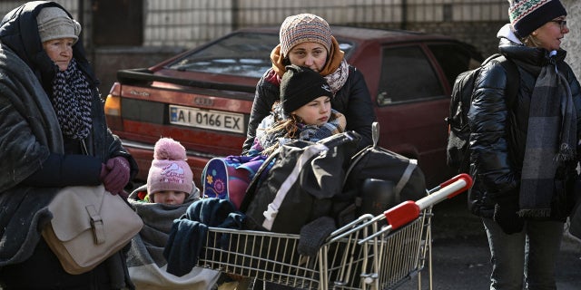 Residents wait to be evacuated from the city of Irpin, north of Kyiv, on March 10, 2022. 