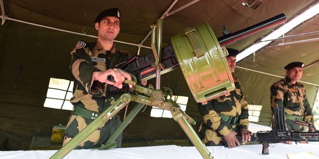 Border Security Force (BSF) personnel display weapons during an exhibition as a part of Azadi ka Amrit Mahotsav programme, on March 10, 2022 in Srinagar, India. (Waseem Andrabi/Hindustan Times via Getty Images)
