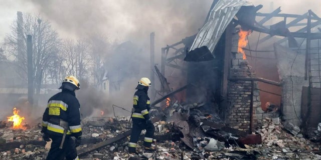 Firefighters at a site after airstrikes hit civil settlements as Russian attacks continue on Ukraine in Dnipro, Ukraine, March 11, 2022.