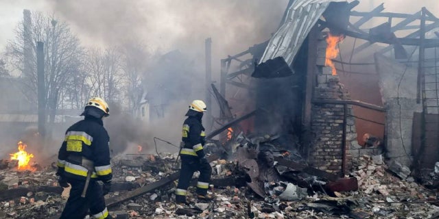 Firefighters at a site after airstrikes hit civil settlements as Russian attacks continue on Ukraine in Dnipro, Ukraine, March 11, 2022.