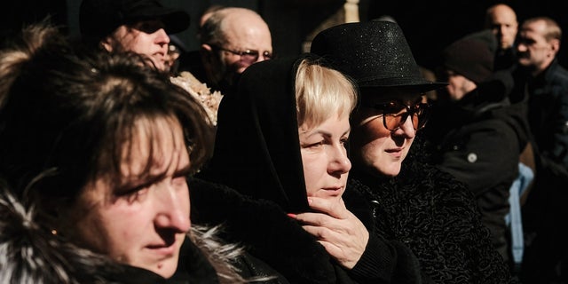 Ukrainians pay their respects to three fallen soldiers killed during the Russian invasion of Ukraine. 