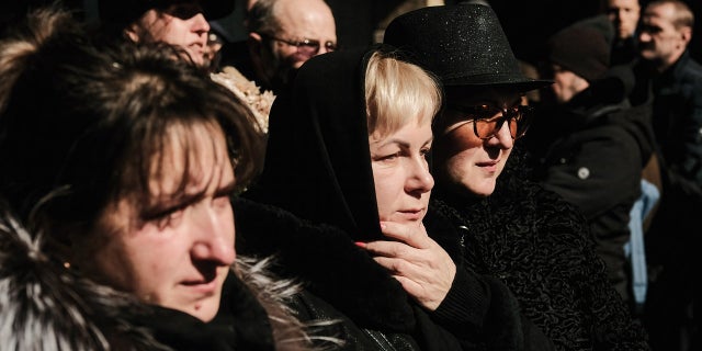 Ukrainians pay their respects to three fallen soldiers killed during the Russian invasion of Ukraine. 