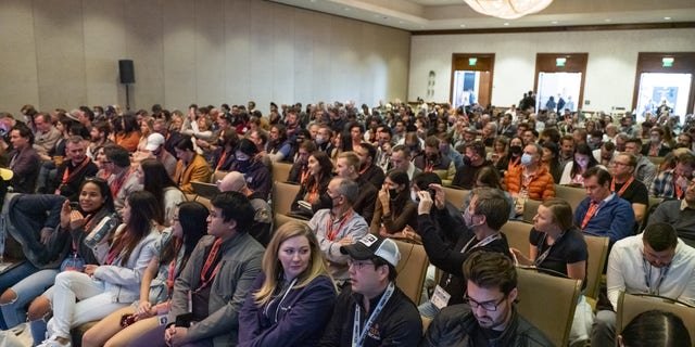 Attendees wait for a panel discussion to begin during SXSW festival in Austin, Texas, March 12, 2022.