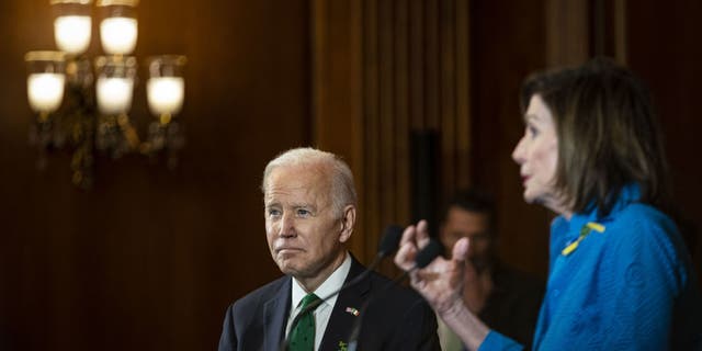 President Joe Biden listens as House Speaker Nancy Pelosi, D-Calif., speaks during the annual Friends of Ireland Luncheon at the Capitol in Washington, D.C., March 17, 2022.