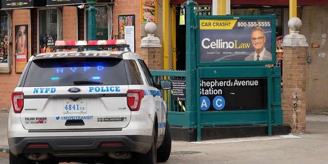  Police investigate a shooting inside the Shepherd Avenue subway station in Brooklyn, New York City on Sunday. 