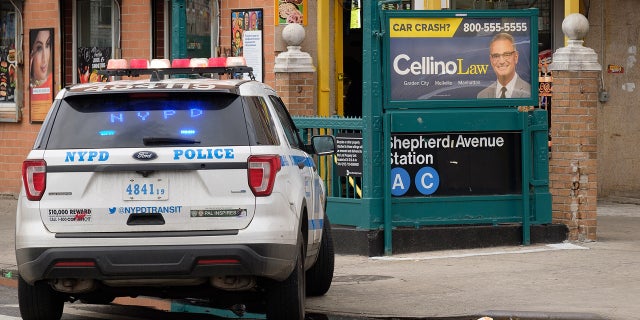 Police investigate a shooting inside the Shepherd Avenue subway station in Brooklyn, New York.