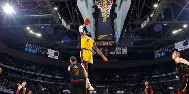 LeBron James #6 of the Los Angeles Lakers dunks the ball during the game against the Cleveland Cavaliers on March 21, 2022, at Rocket Mortgage FieldHouse in Cleveland, Ohio.