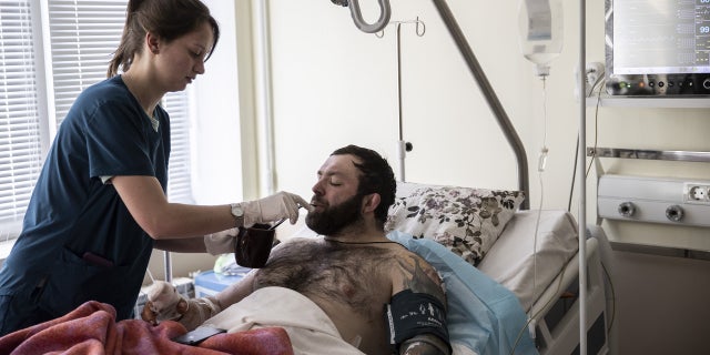 KYIV, UKRAINE - MARCH 18: A soldier injured due to Russian attacks on Ukraine gets treatment in Kyiv, Ukraine on March 18, 2022.