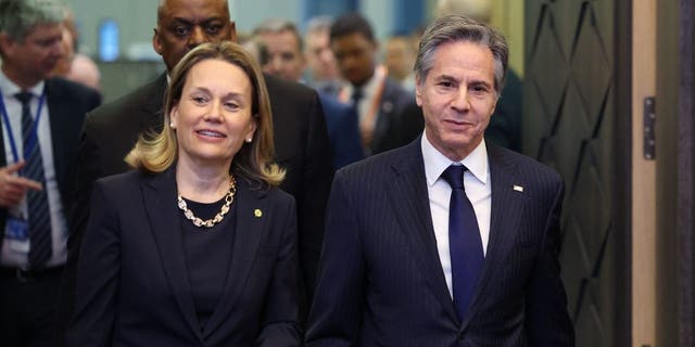 US Permanent Representative to NATO Julianne Smith (L) and US Secretary of State Antony Blinken (R) arrive ahead of an extraordinary NATO summit at NATO Headquarters in Brussels on March 24, 2022. 
