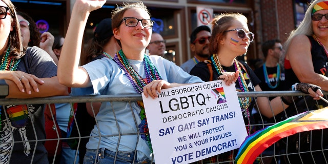 TAMPA, FL - MARCH 26: Revelers celebrate on 7th Avenue during the Tampa Pride Parade in the Ybor City neighborhood on March 26, 2022 in Tampa, Florida. 