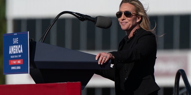 Marjorie Taylor Greene, a Republican from Georgia, speaks at a campaign event headlined by former President Donald Trump in Commerce, Georgia, U.S., on Saturday, March 26, 2022. Photographer: Elijah Nouvelage/Bloomberg via Getty Images