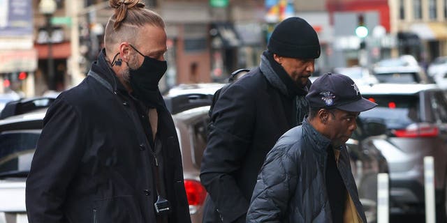 Actor/comedian Chris Rock enters the Wilbur Theater in Boston for the first of his two sold-out performances March 30, 2022. Three days earlier, Rock was slapped by Will Smith at the Academy Awards.