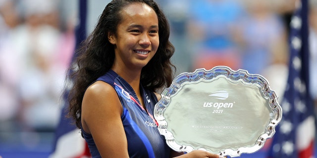 Leylah Annie Fernandez of Canada celebrates with the runner-up trophy after being defeated by Emma Raducanu of Great Britain during their Women's Singles final match on Day Thirteen of the 2021 US Open at the USTA Billie Jean King National Tennis Center on September 11, 2021 in the Flushing neighborhood of the Queens borough of New York City.