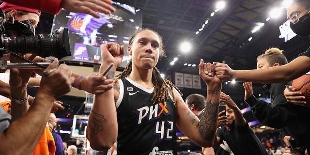 Britney Greener № 42 of Phoenix Mercury celebrates with fans after the second game of the 2021 WNBA Finals at the Footprint Center on October 13, 2021 in Phoenix.  In overtime, 