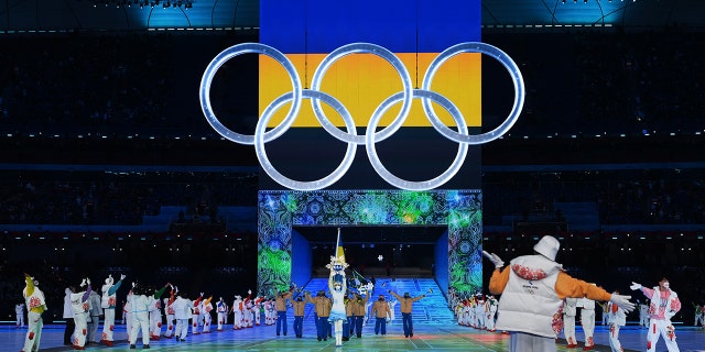 Flag bearers Oleksandr Abramenko and Oleksandra Nazarova of Team Ukraine lead their team out during the Opening Ceremony of the Beijing 2022 Winter Olympics at the Beijing National Stadium on Feb. 4, 2022 in Beijing, China.