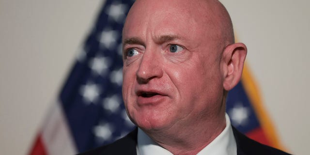 Feb. 8, 2022: Sen. Mark Kelly (D-AZ) speaks during a press conference following the weekly Democratic caucus policy luncheon in Washington, DC.  (Photo by Win McNamee/Getty Images)