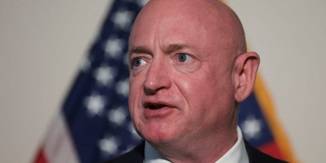 Feb. 8, 2022: Sen. Mark Kelly (D-AZ) speaks during a press conference following the weekly Democratic caucus policy luncheon in Washington, DC.  (Photo by Win McNamee/Getty Images)