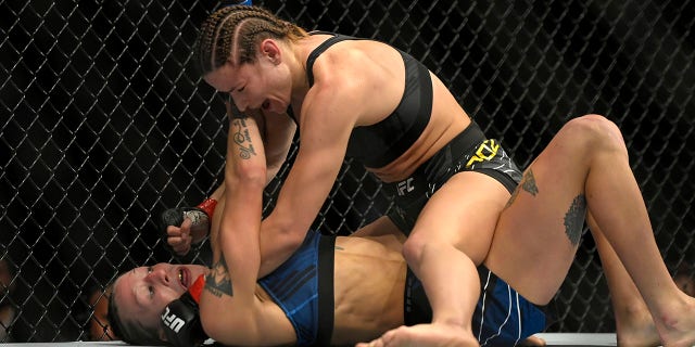 Maryna Moroz atop Mariya Agapova in their flyweight bout at UFC 272 on March 5, 2022 in Las Vegas, Nevada.