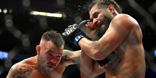 Colby Covington (L) and Jorge Masvidal battle in their welterweight fight during UFC 272 at T-Mobile Arena on March 05, 2022, in Las Vegas, Nevada.