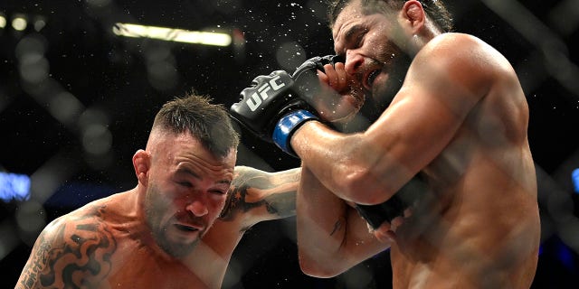 Colby Covington (L) and Jorge Masvidal battle in their welterweight fight during UFC 272 at T-Mobile Arena on March 05, 2022, in Las Vegas, Nevada.
