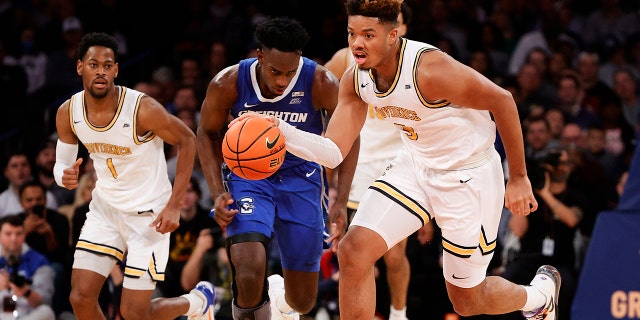 Ed Croswell of the Providence Friars gets a steal in the second half of the game against the Creighton Bluejays during the 2022 Big East Tournament at Madison Square Garden on March 11, 2022, in New York City.