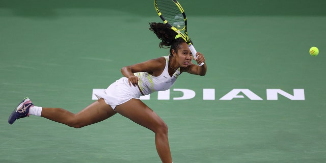 Leylah Fernandez of Canada hits a forehand in her match against Shelby Rogers of The United States during the BNP Parisbas Open at the Indian Wells Tennis Garden on March 14, 2022 in Indian Wells, California.