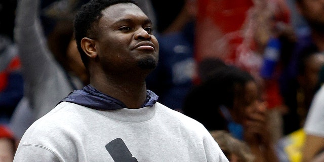 Zion Williamson #1 of the New Orleans Pelicans stands next to the bench during the third quarter of an NBA game against the Phoenix Suns at Smoothie King Center on March 15, 2022, in New Orleans, Louisiana.