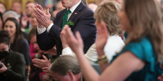 President Joe Biden applauds for entertainers who performed during an event celebrating St. Patrick’s Day in the East Room of the White House March 17, 2022, in Washington, D.C. (Photo by Win McNamee/Getty Images)