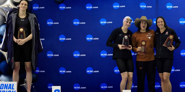 From left to right: Lia Thomas of the University of Pennsylvania standing on the podium after winning the 500-yard freestyle as other medalists Emma Weyant, Erica Sullivan and Brooke Forde pose for a photo at the NCAA Division I Women's Swimming and Diving Championship on March 17, 2022, in Atlanta. 