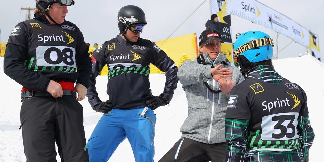 (L-R) Nate Holland, J.J. Tomlinson, Peter Foley, U.S. Snowboarding Head Coach, and Graham Watanabe discuss the course during training prior to snowboard cross qualification during the Sprint U.S. Grand Prix at The Canyons Ski Resort on February 10, 2012 in Park City, Utah.