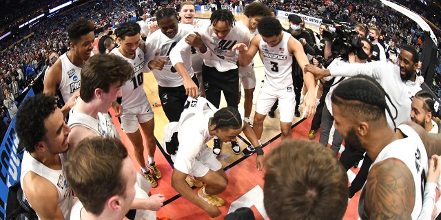 The Providence Friars celebrate winning the second-round game of the 2022 NCAA Men's Basketball Tournament against the Richmond Spiders at KeyBank Center on March 19, 2022, in Buffalo, New York.