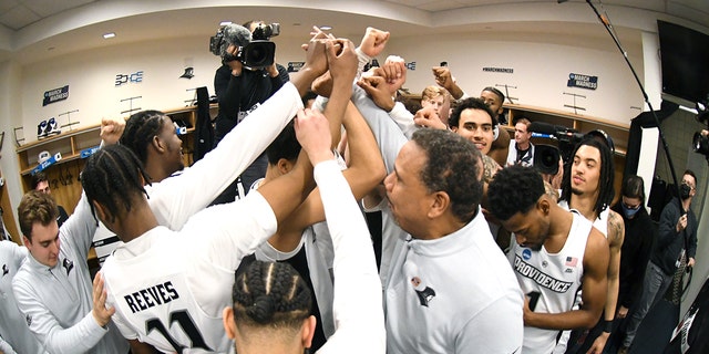 The Providence Friars celebrate winning the second-round game of the 2022 NCAA Men's Basketball Tournament against the Richmond Spiders at KeyBank Center on March 19, 2022, in Buffalo, New York.  