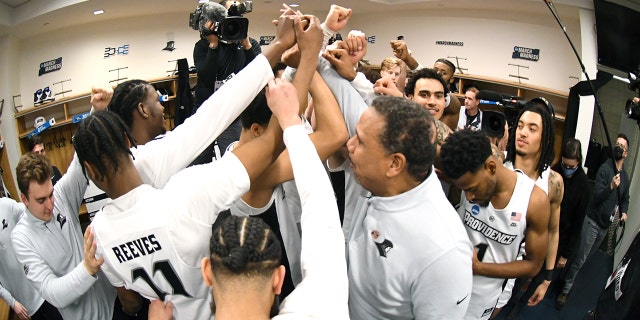 The Providence Friars celebrate winning the second-round game of the 2022 NCAA Men's Basketball Tournament against the Richmond Spiders at KeyBank Center on March 19, 2022, in Buffalo, New York.