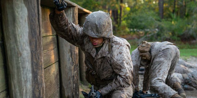 Marine Corps recruits are run through a simulated resupply exercise. (Photo by Robert Nickelsberg/Getty Images)