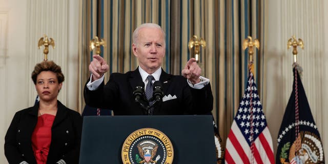 President Joe Biden speaks alongside Director of the Office of Management and Budget Shalanda Young as he introduces his budget request for fiscal year 2023 in the State Dining Room of the White House on March 28, 2022, in Washington, D.C.