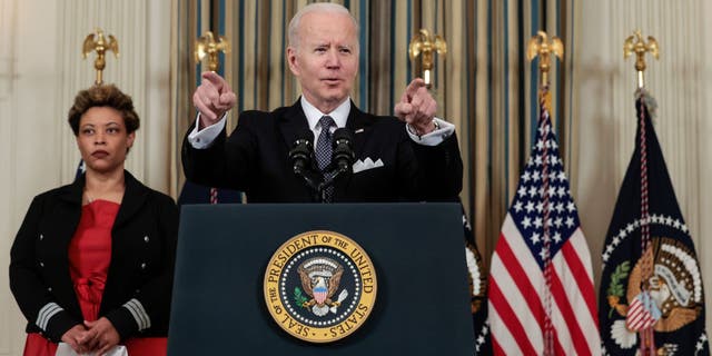 President Joe Biden speaks alongside Director of the Office of Management and Budget Shalanda Young as he introduces his budget request for fiscal year 2023 in the State Dining Room of the White House on March 28, 202, in Washington, DC