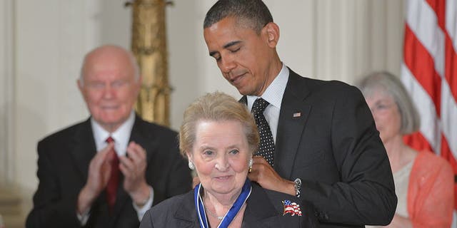 Former President Barack Obama presents the Presidential Medal of Freedom to former Secretary of State Madeleine Albright during a ceremony on May 29, 2012.