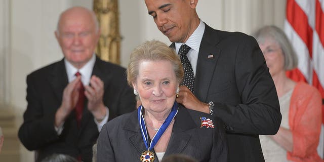 Former President Barack Obama presents the Presidential Medal of Freedom to former Secretary of State Madeleine Albright on May 29, 2012.