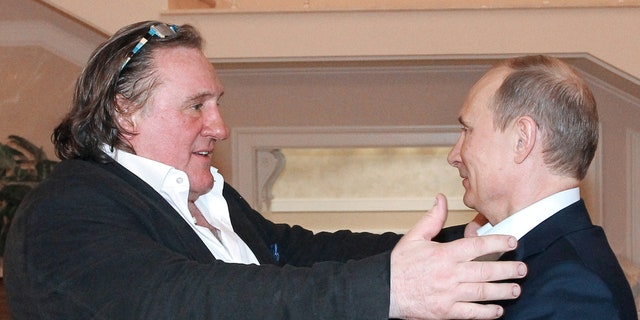 This photo taken Jan. 5, 2013, shows Russian President Vladimir Putin greeting French actor Gerard Depardieu during their meeting in Putin's home in Sochi.