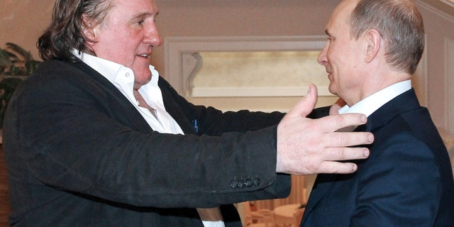 This photo taken Jan. 5, 2013, shows Russian President Vladimir Putin greeting French actor Gerard Depardieu during their meeting in Putin's home in Sochi.