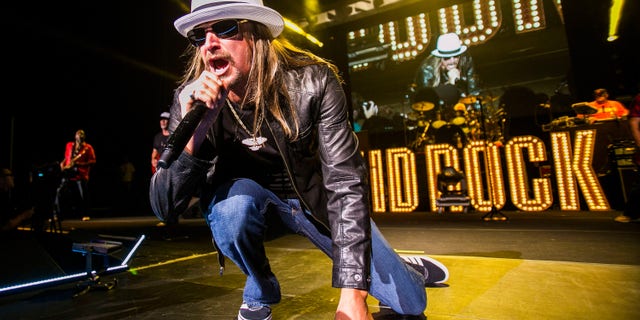 Fans were seen hurling beer cans and bottles toward the stage after Kid Rock's performance was canceled.