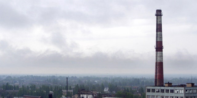 MELITOPOL, UKRAINE: Smoke floats above Melitopol, a small town in southeastern Ukraine, 07 May 2004. AFP PHOTO/ Sergei SUPINSKY/ ss